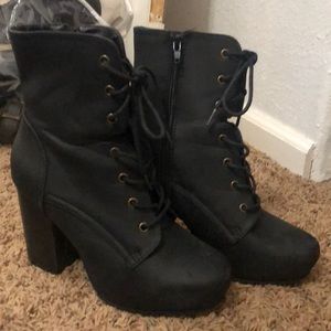 Black heeled combat booties